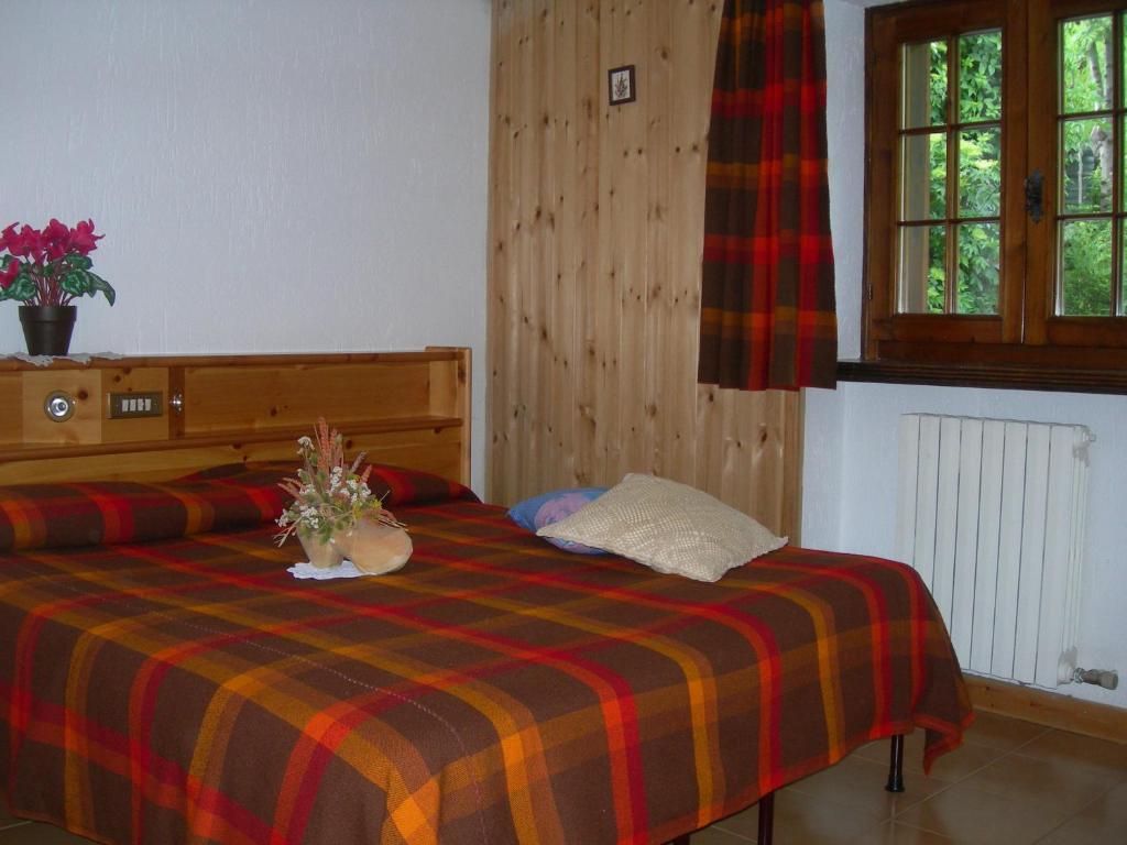 Postel nebo postele na pokoji v ubytování Agriturismo Lo Ratelé