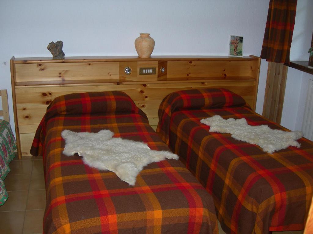 Postel nebo postele na pokoji v ubytování Agriturismo Lo Ratelé