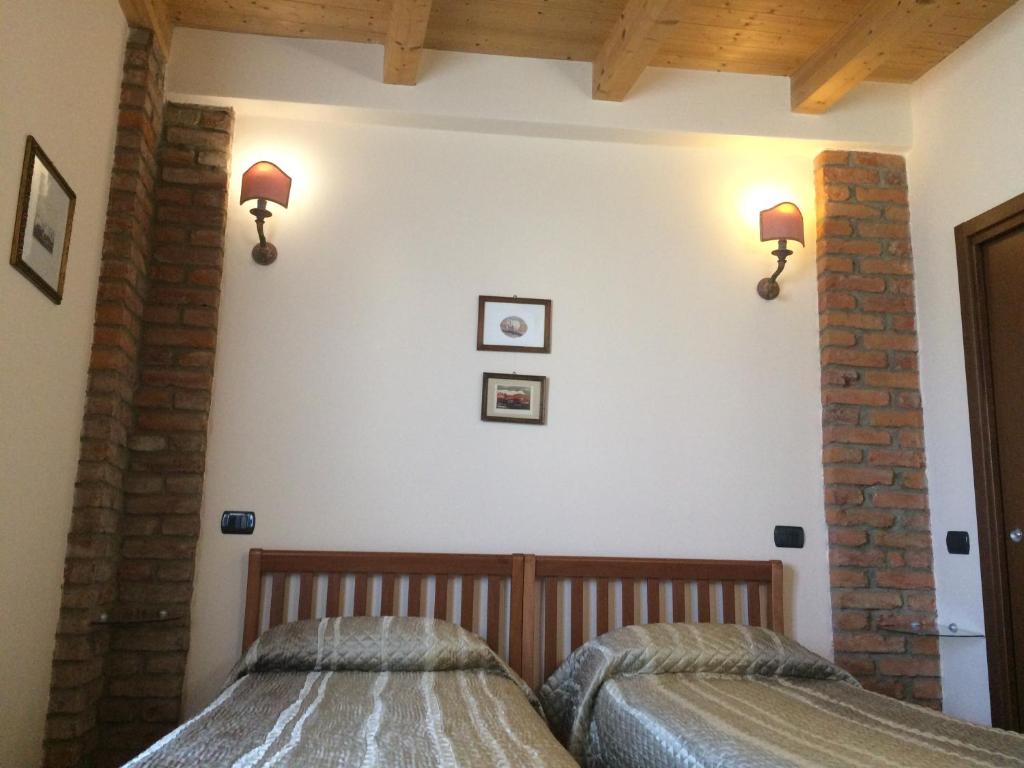 Postel nebo postele na pokoji v ubytování B&B Il Rustico