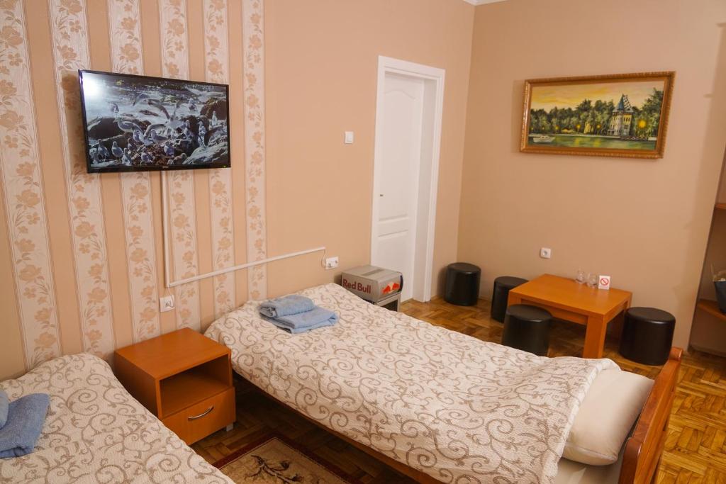 Postel nebo postele na pokoji v ubytování Amfora
