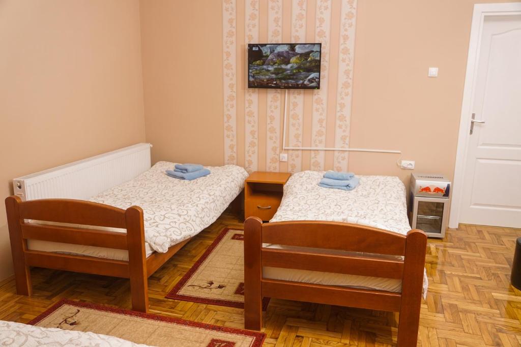 Postel nebo postele na pokoji v ubytování Amfora