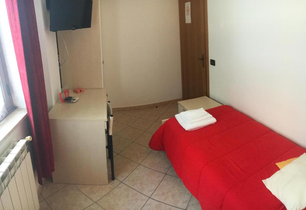 Łóżko lub łóżka w pokoju w obiekcie B&B Villa Giglio