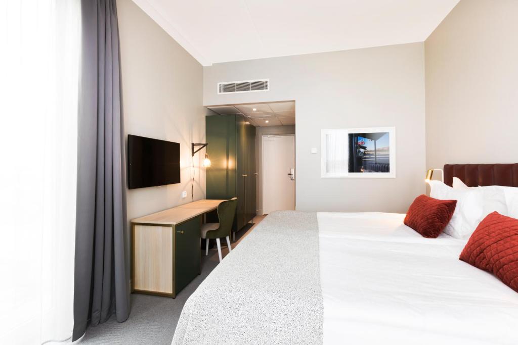 TV a/nebo společenská místnost v ubytování Elite Hotel Academia