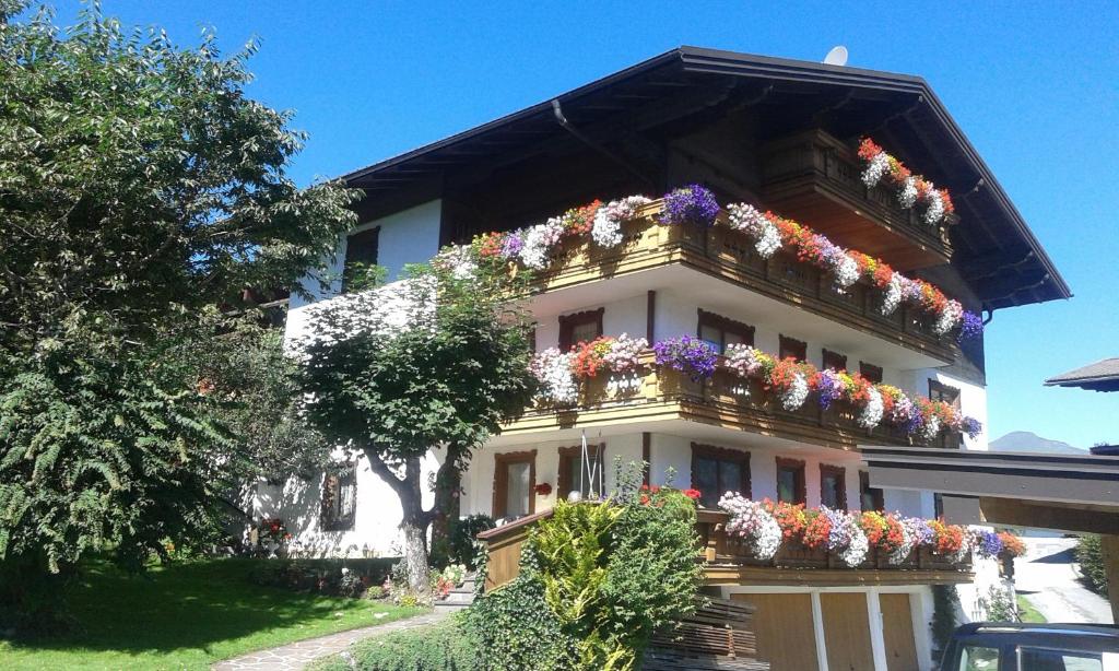 a white house with flower boxes on it at Haus Talblick in Bad Gastein
