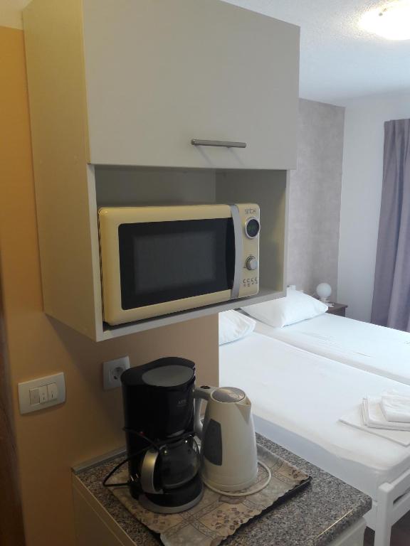 Postel nebo postele na pokoji v ubytování Roza Guest House