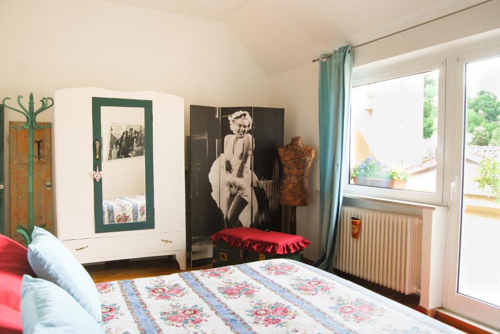 Łóżko lub łóżka w pokoju w obiekcie A Casa di Lola