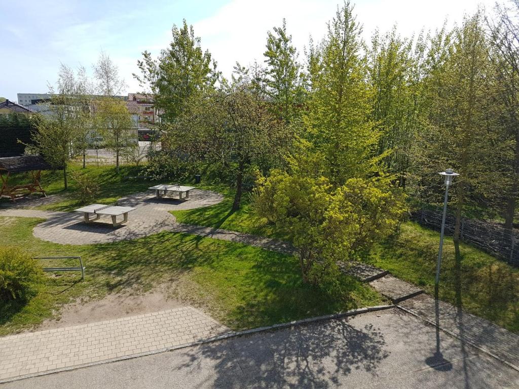 an overhead view of a park with benches and trees at Hanse Haus Pension in Greifswald