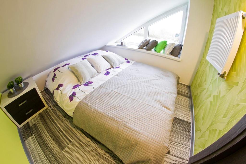 Posteľ alebo postele v izbe v ubytovaní Park Apartament