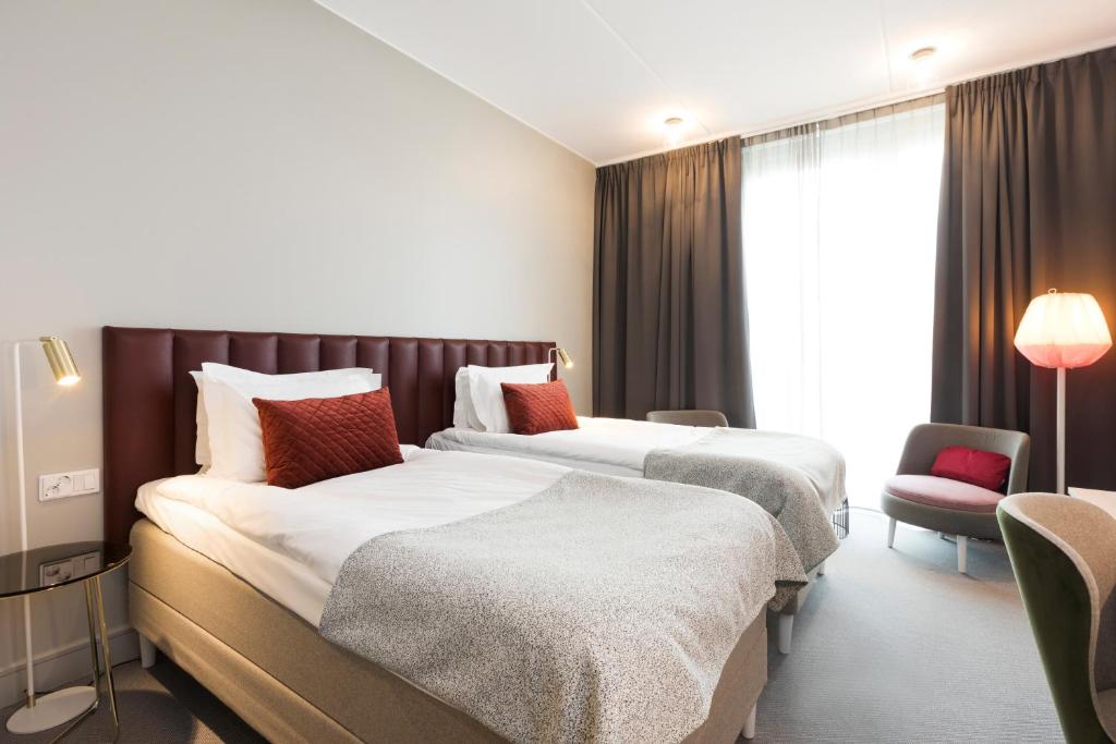 Postel nebo postele na pokoji v ubytování Elite Hotel Academia