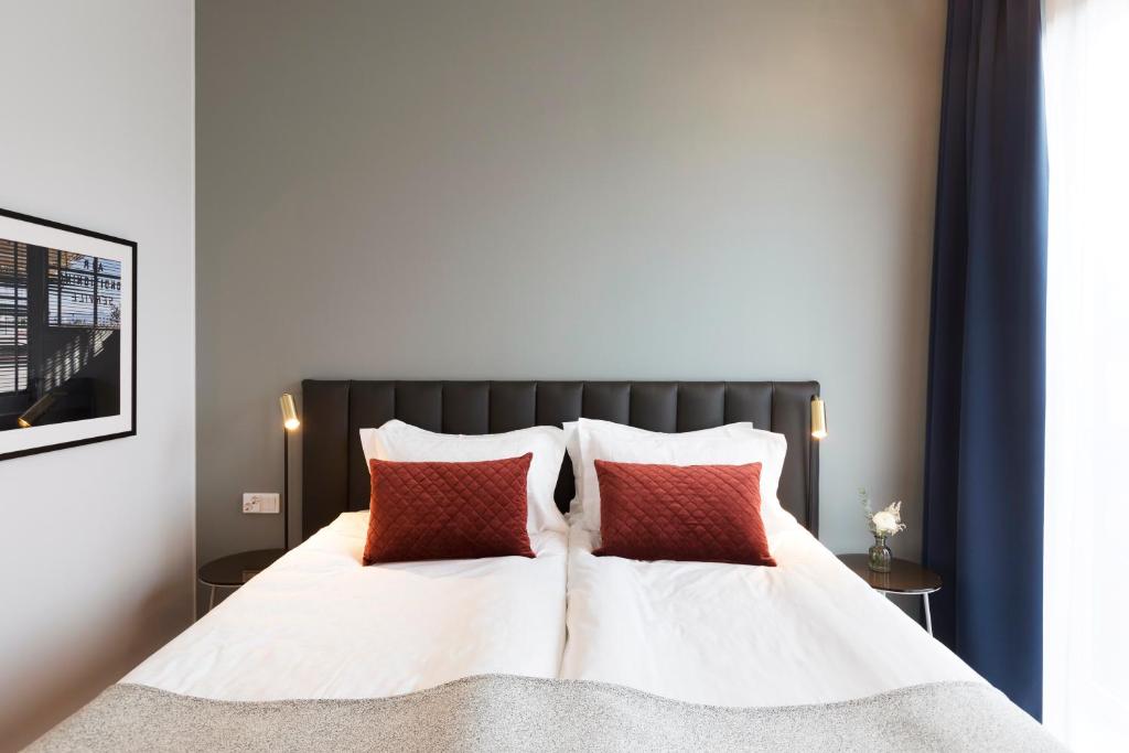Postel nebo postele na pokoji v ubytování Elite Hotel Academia