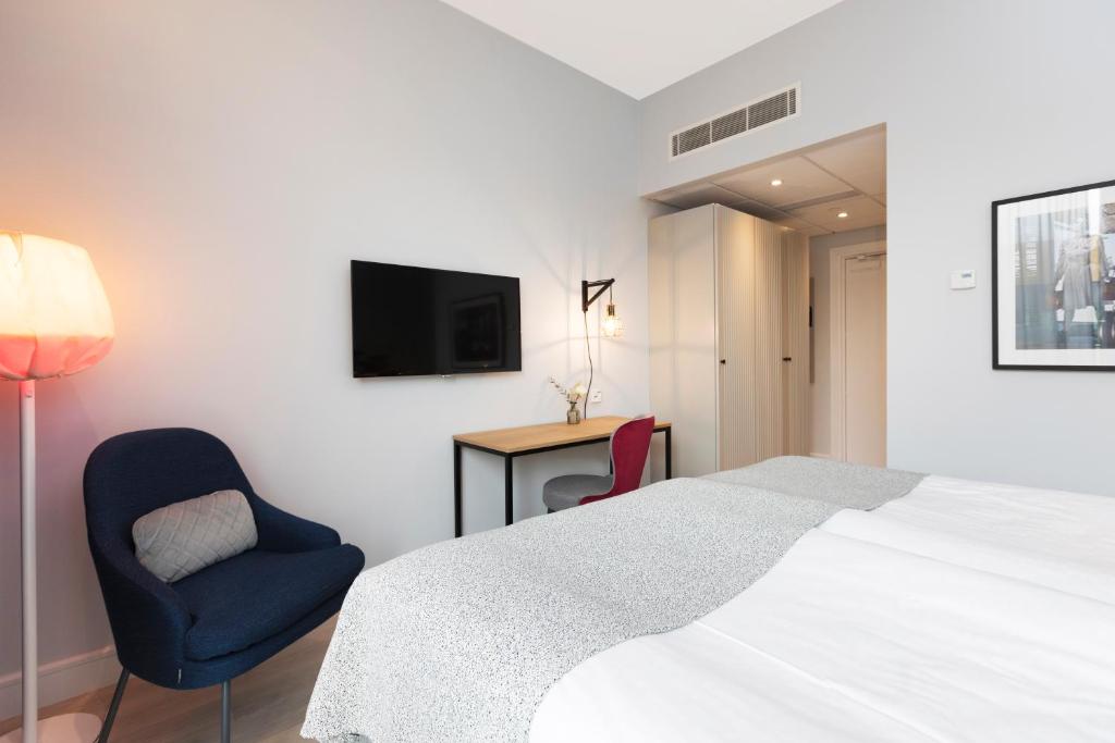 Postel nebo postele na pokoji v ubytování Elite Hotel Academia