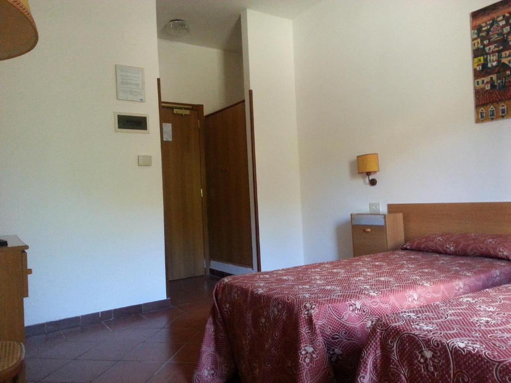 Postel nebo postele na pokoji v ubytování Hotel Tempio di Apollo