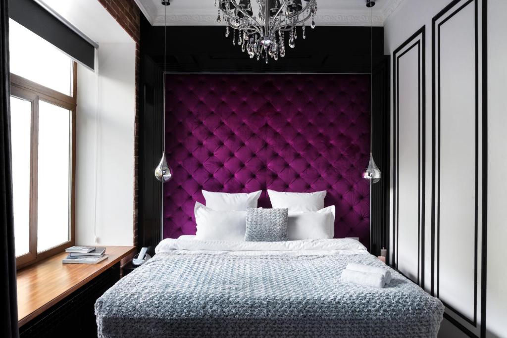 Postel nebo postele na pokoji v ubytování Theatre Boutique Apartments