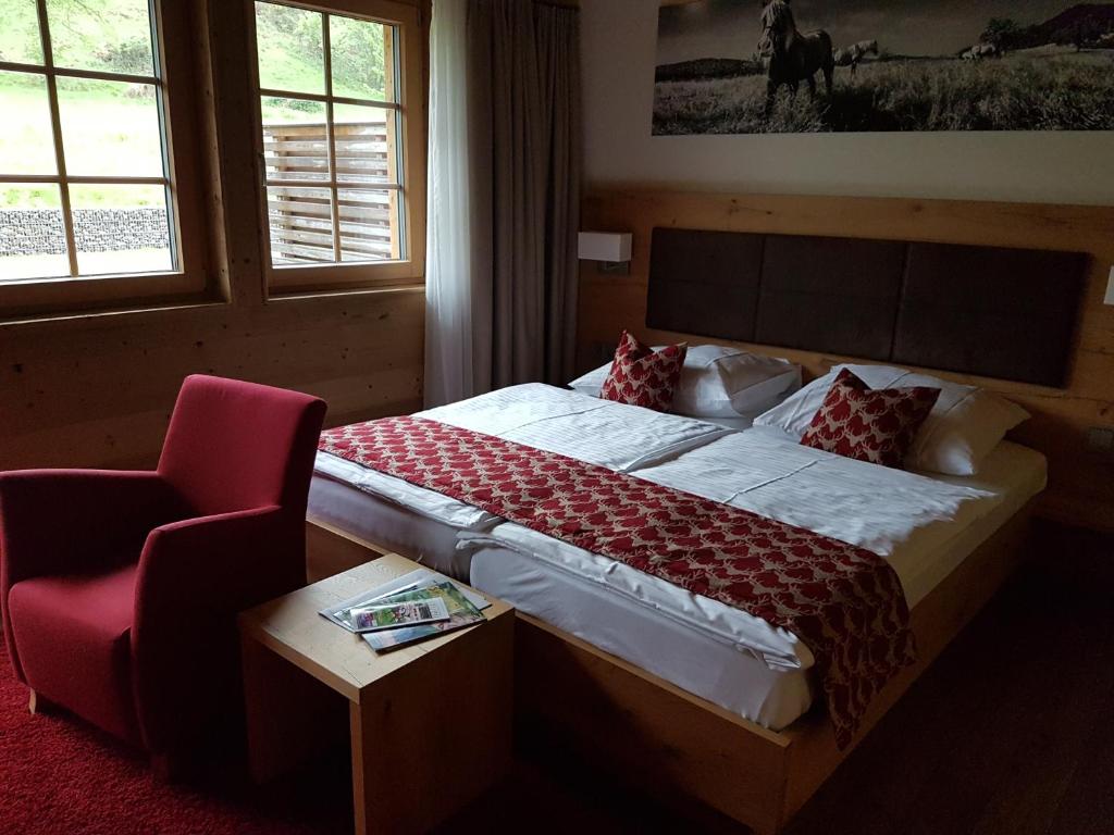 Postel nebo postele na pokoji v ubytování Gästehaus der Geroldsauer Mühle