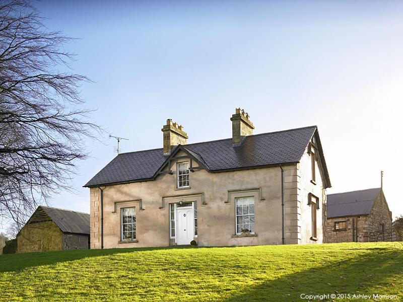 a house on top of a grassy hill at The Brook in Enniskillen