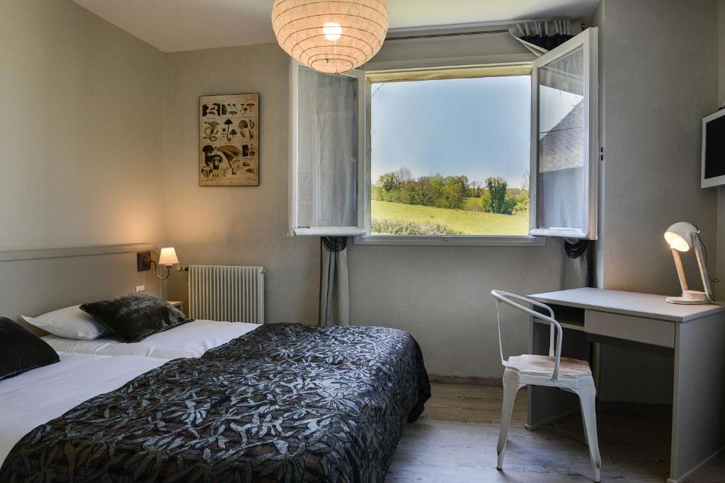 Cama o camas de una habitación en Hôtel Les Bains de Secours