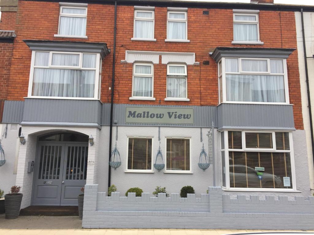 a brick building with a mallow view sign on it at Mallowview Bed and Breakfast in Cleethorpes