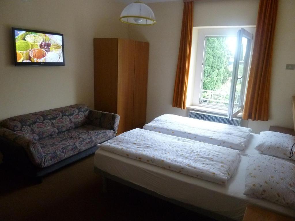 Postel nebo postele na pokoji v ubytování Garnì Ischia