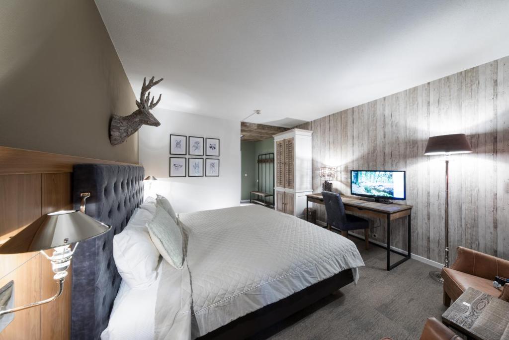 TV a/nebo společenská místnost v ubytování Bilderberg Hotel 't Speulderbos