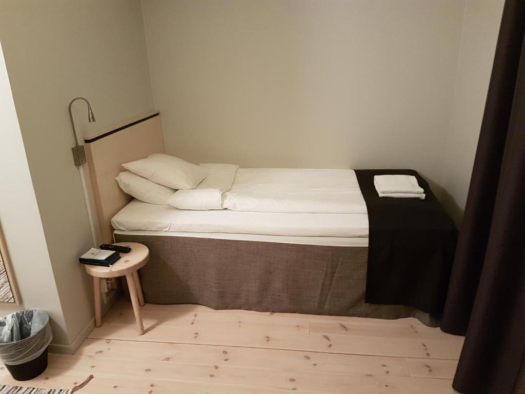 Postel nebo postele na pokoji v ubytování Hotel Akerlund