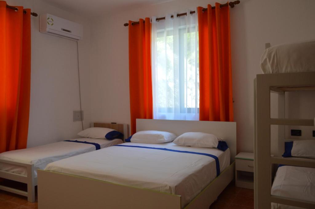 Voodi või voodid majutusasutuse Hotel Bolonja toas