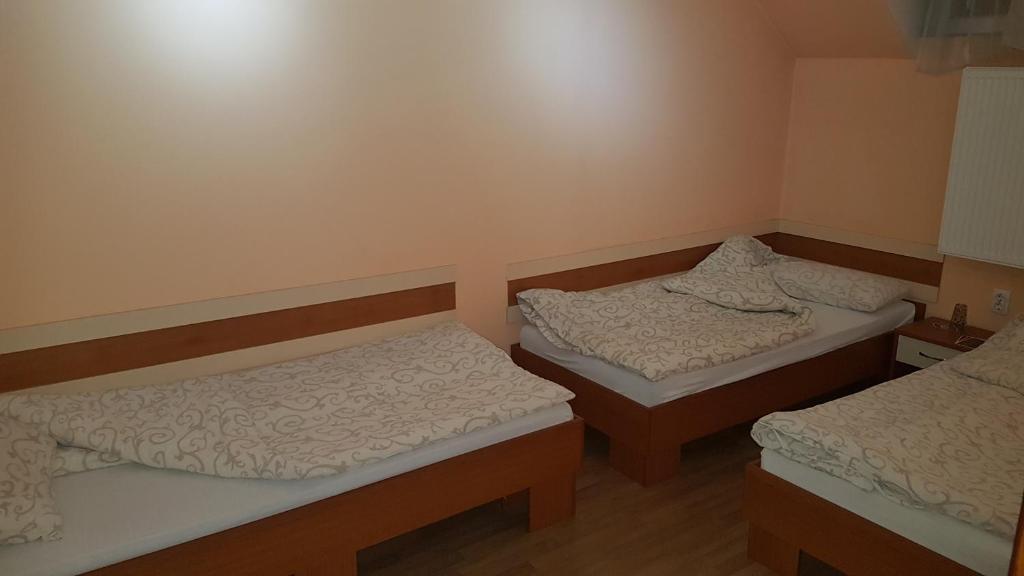 Postel nebo postele na pokoji v ubytování Guest house Kruna