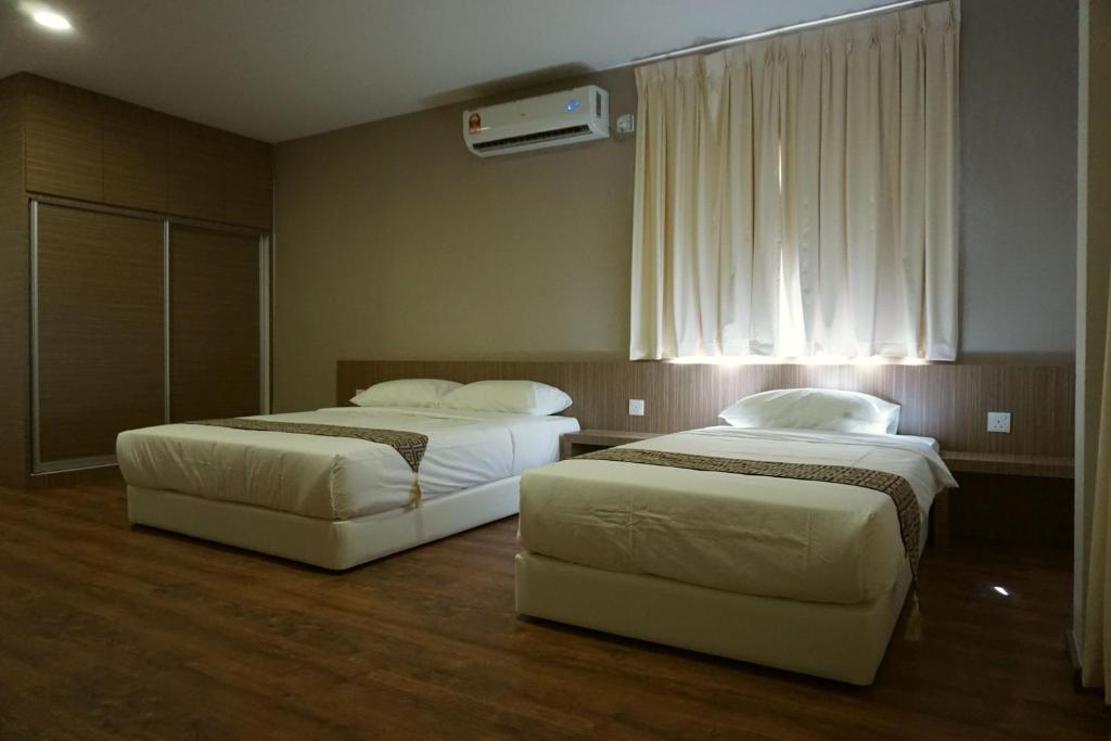 Postel nebo postele na pokoji v ubytování Yew Hotel