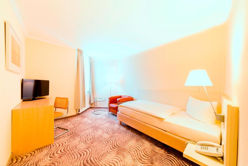 TV a/nebo společenská místnost v ubytování Michels Thalasso Hotel Nordseehaus