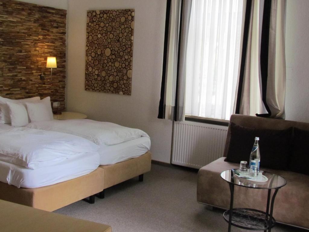 Postel nebo postele na pokoji v ubytování Hotel Almrausch