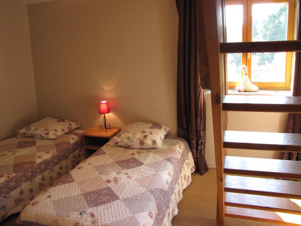 Postel nebo postele na pokoji v ubytování L'Ecurie chambre d'hôtes