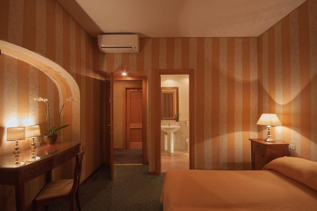 Posteľ alebo postele v izbe v ubytovaní Orange Garden Guest House