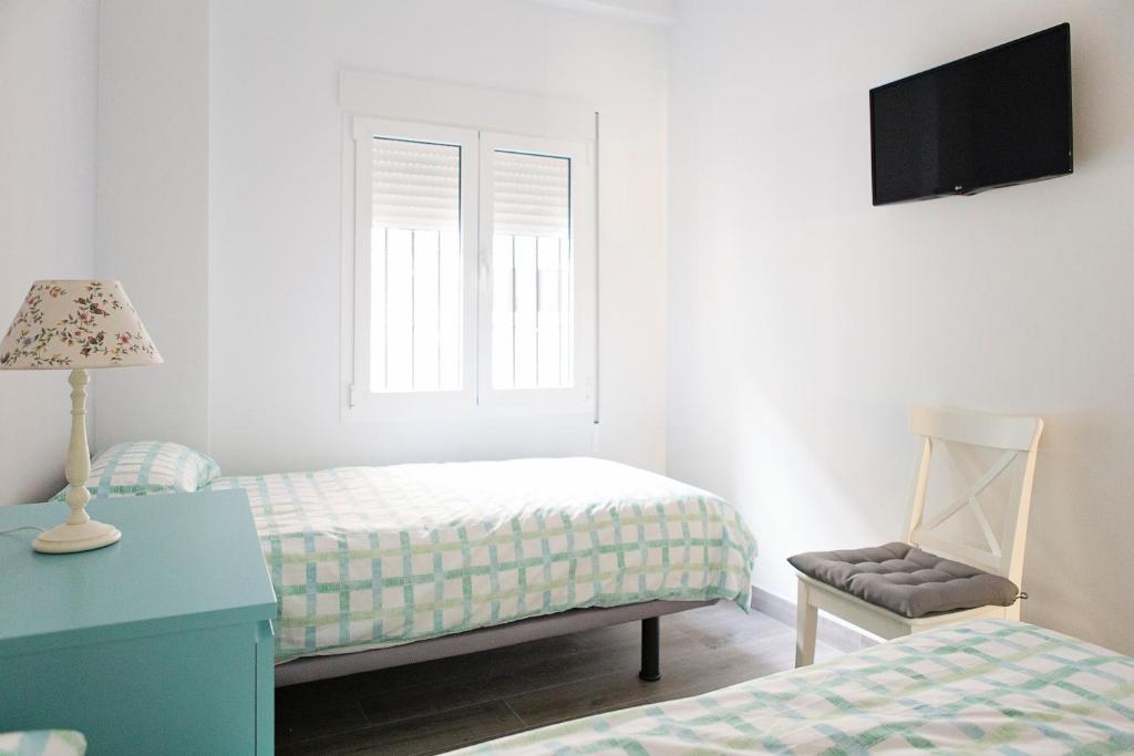 Posteľ alebo postele v izbe v ubytovaní Hello Málaga Flat Victoria