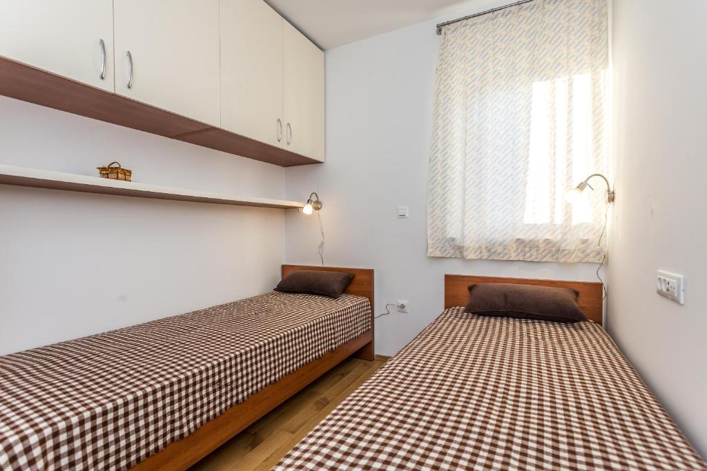 Postel nebo postele na pokoji v ubytování Villa Antonina