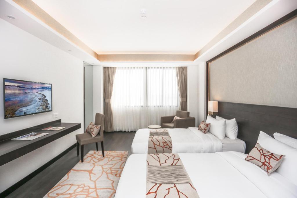 Postel nebo postele na pokoji v ubytování Hotel Mulberry