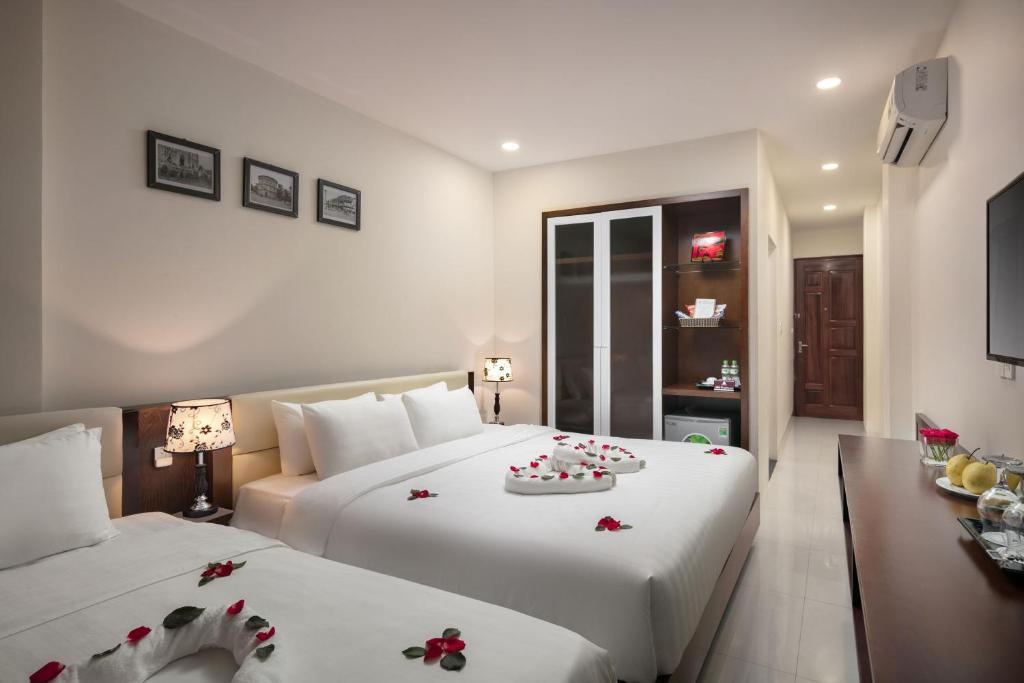 Postel nebo postele na pokoji v ubytování Dream Central Hotel & Spa - Hanoi Old Quarter