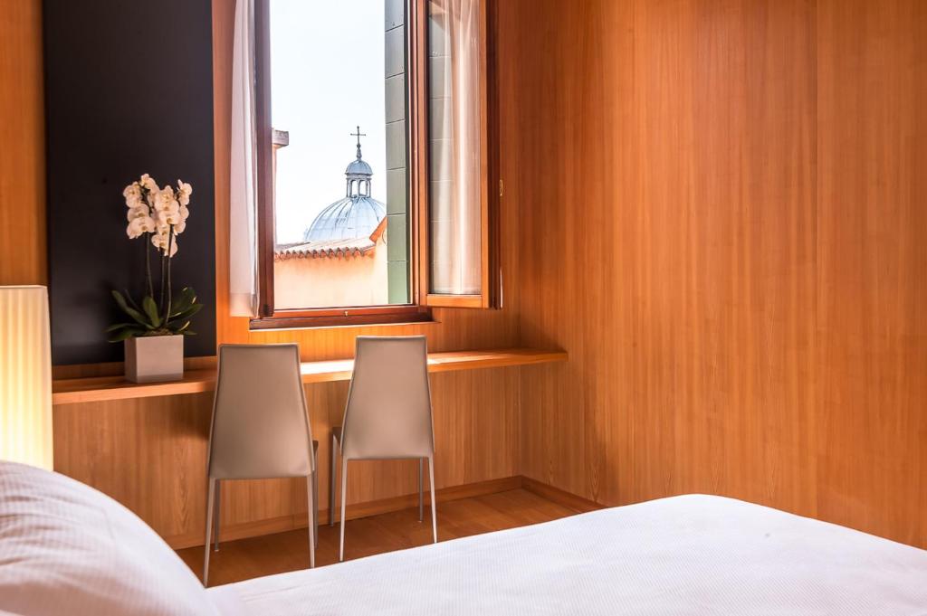 Postel nebo postele na pokoji v ubytování Ca' Cappellis