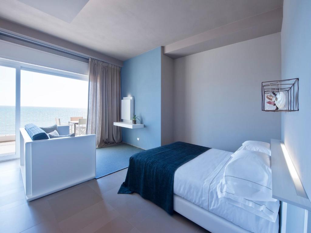 Кровать или кровати в номере Il Fogliano Hotel New Life