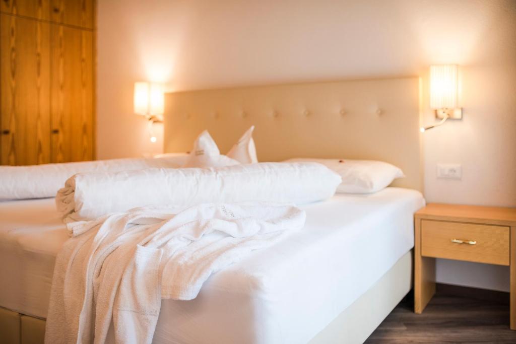 Postel nebo postele na pokoji v ubytování Hotel Theresia