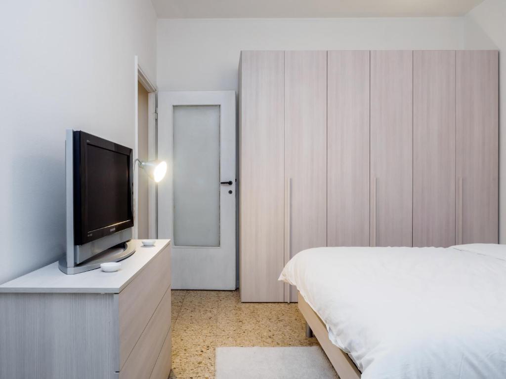 Televízia a/alebo spoločenská miestnosť v ubytovaní Enjoy Apartment Gorla