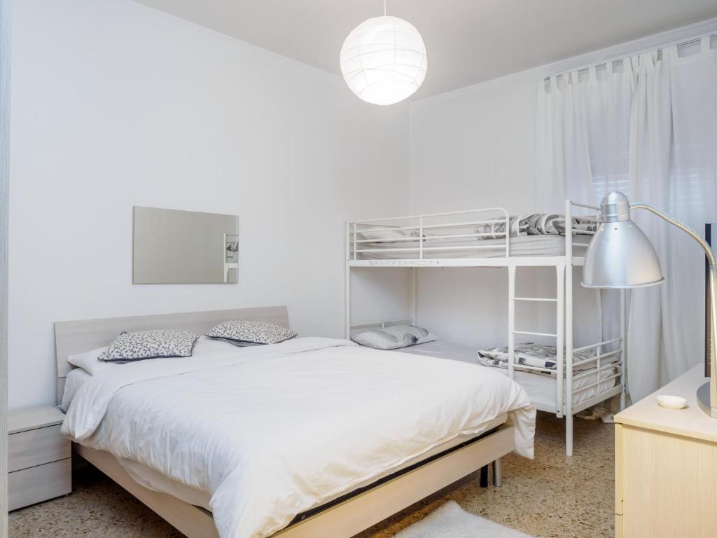 Posteľ alebo postele v izbe v ubytovaní Enjoy Apartment Gorla