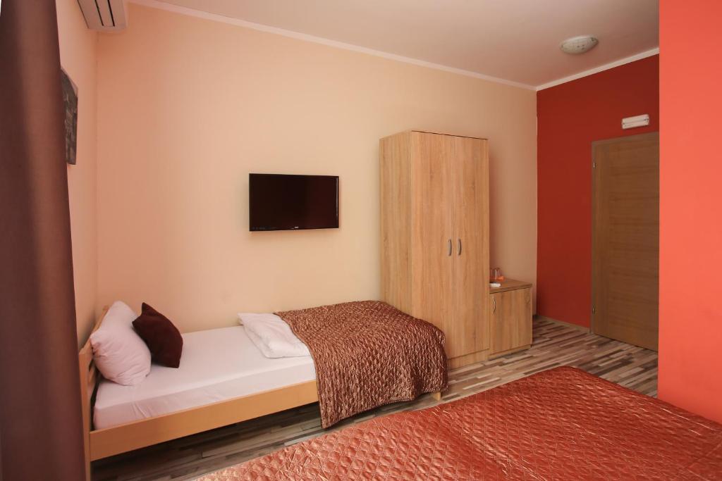 Postel nebo postele na pokoji v ubytování Hotel Hana