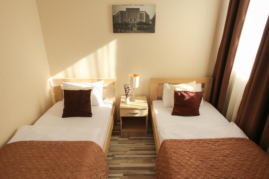 Postel nebo postele na pokoji v ubytování Hotel Hana