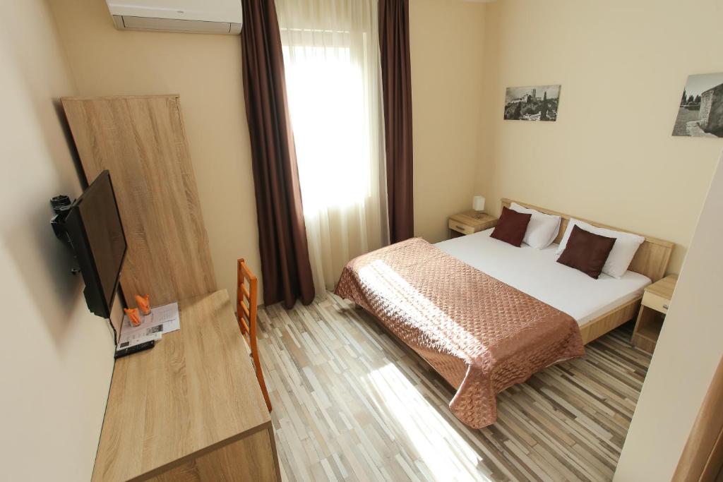 Postel nebo postele na pokoji v ubytování Hotel Hana