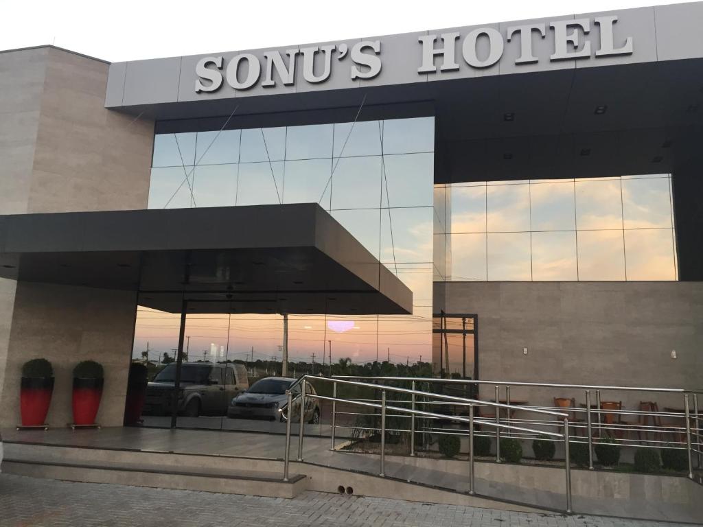 a car dealership with a sign on the side of a building at Sonus Hotel in Sinop