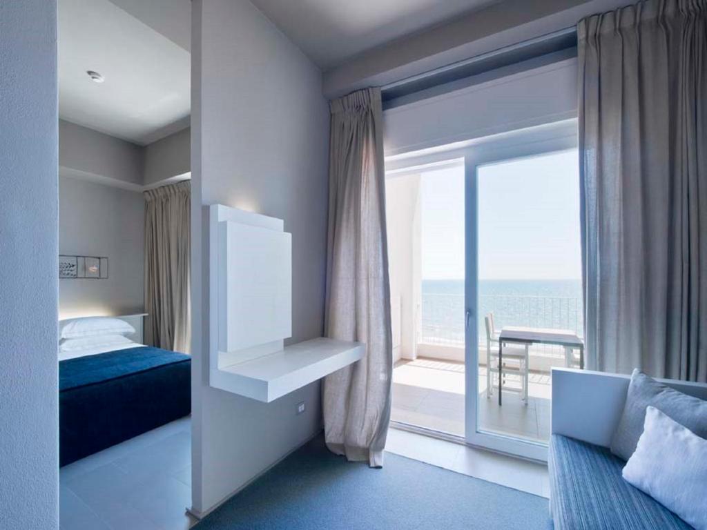 Кровать или кровати в номере Il Fogliano Hotel New Life