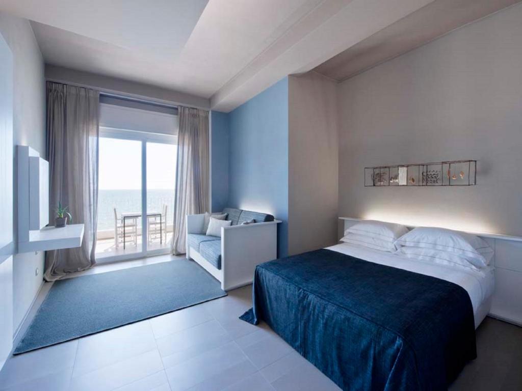 Кровать или кровати в номере Il Fogliano Hotel New Life