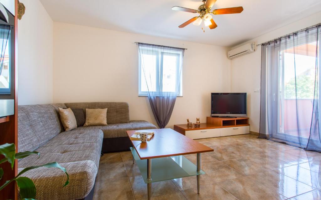 Telewizja i/lub zestaw kina domowego w obiekcie Apartman Deja
