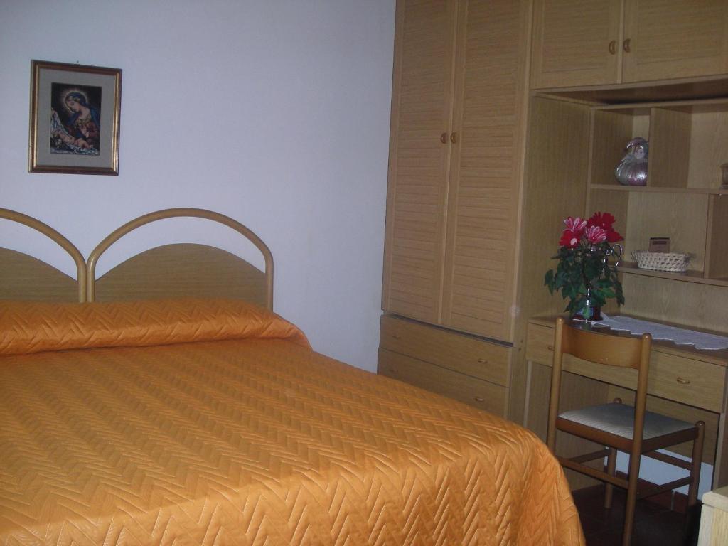 Postel nebo postele na pokoji v ubytování B&B L'Arcobaleno