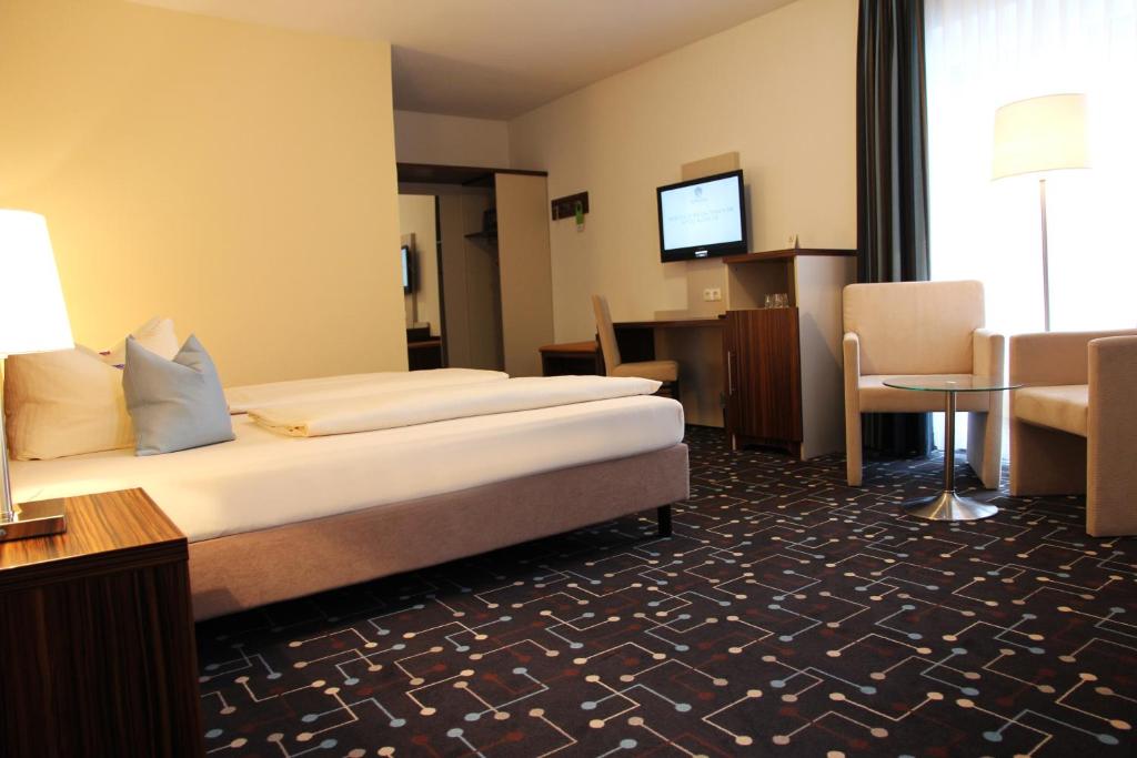 Postel nebo postele na pokoji v ubytování Hotel Königer