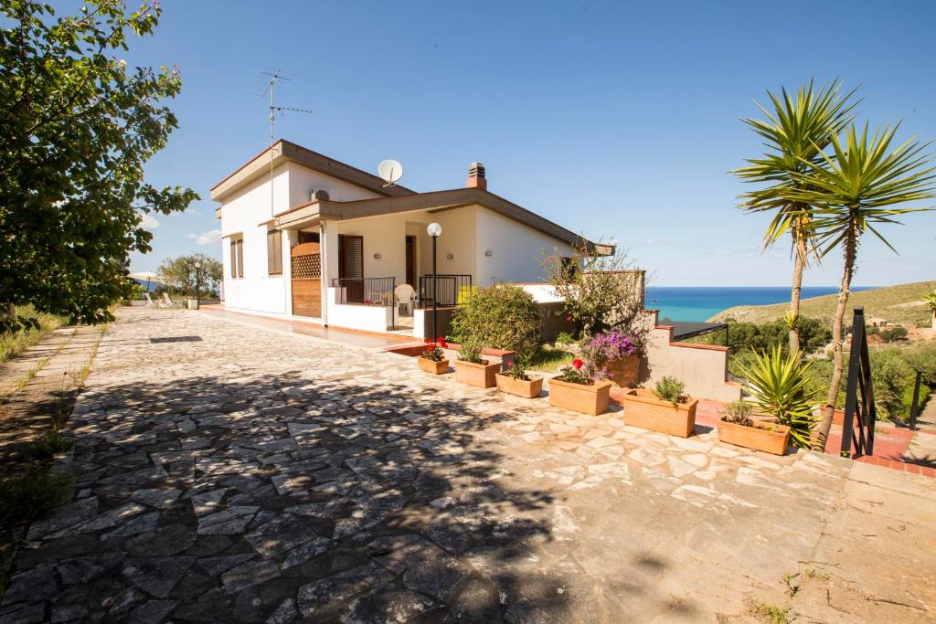a house with a view of the ocean at Villa Duca Country House in Castellammare del Golfo